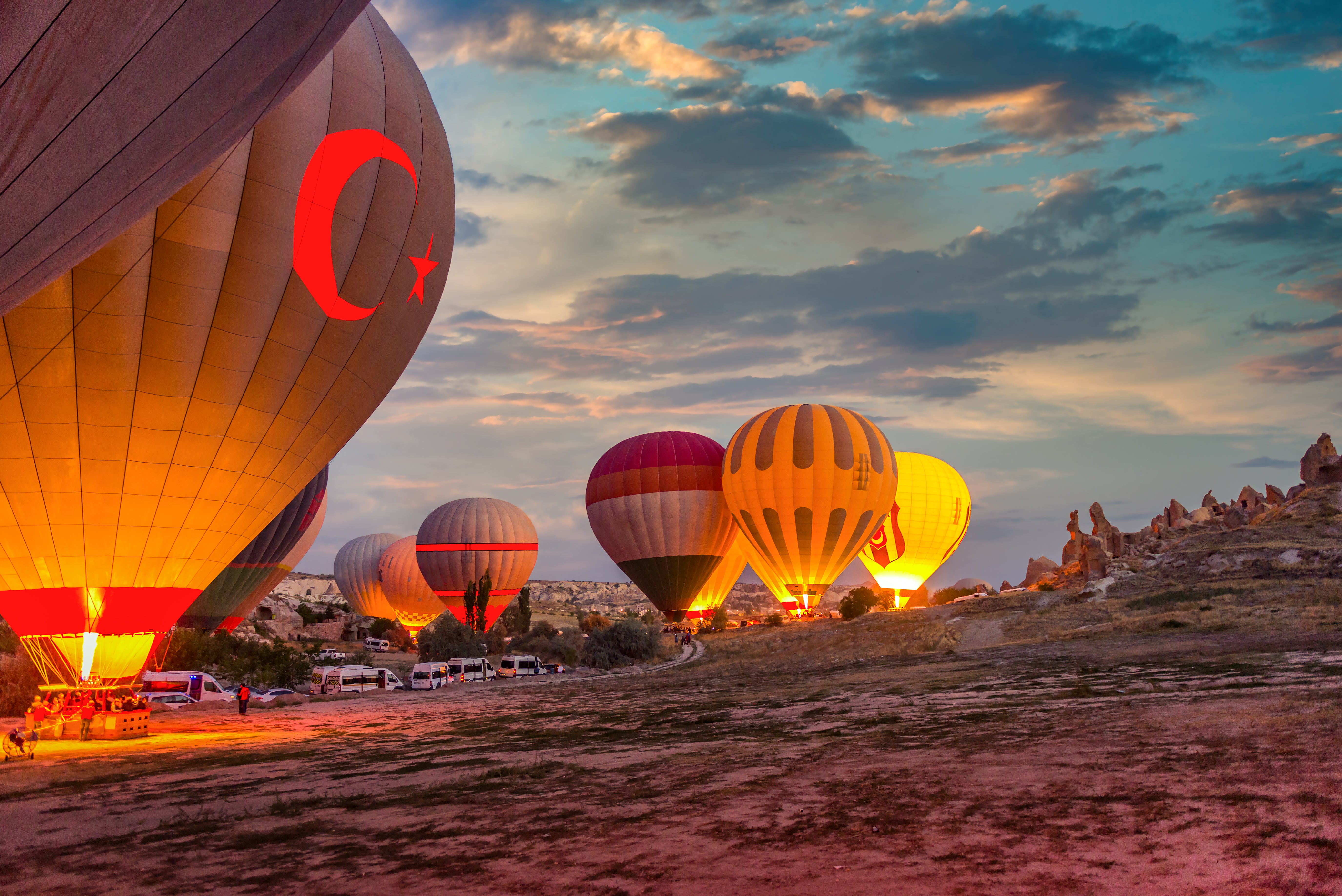 Hot air balloons in Cappadocia, Turkey launch at sunrise