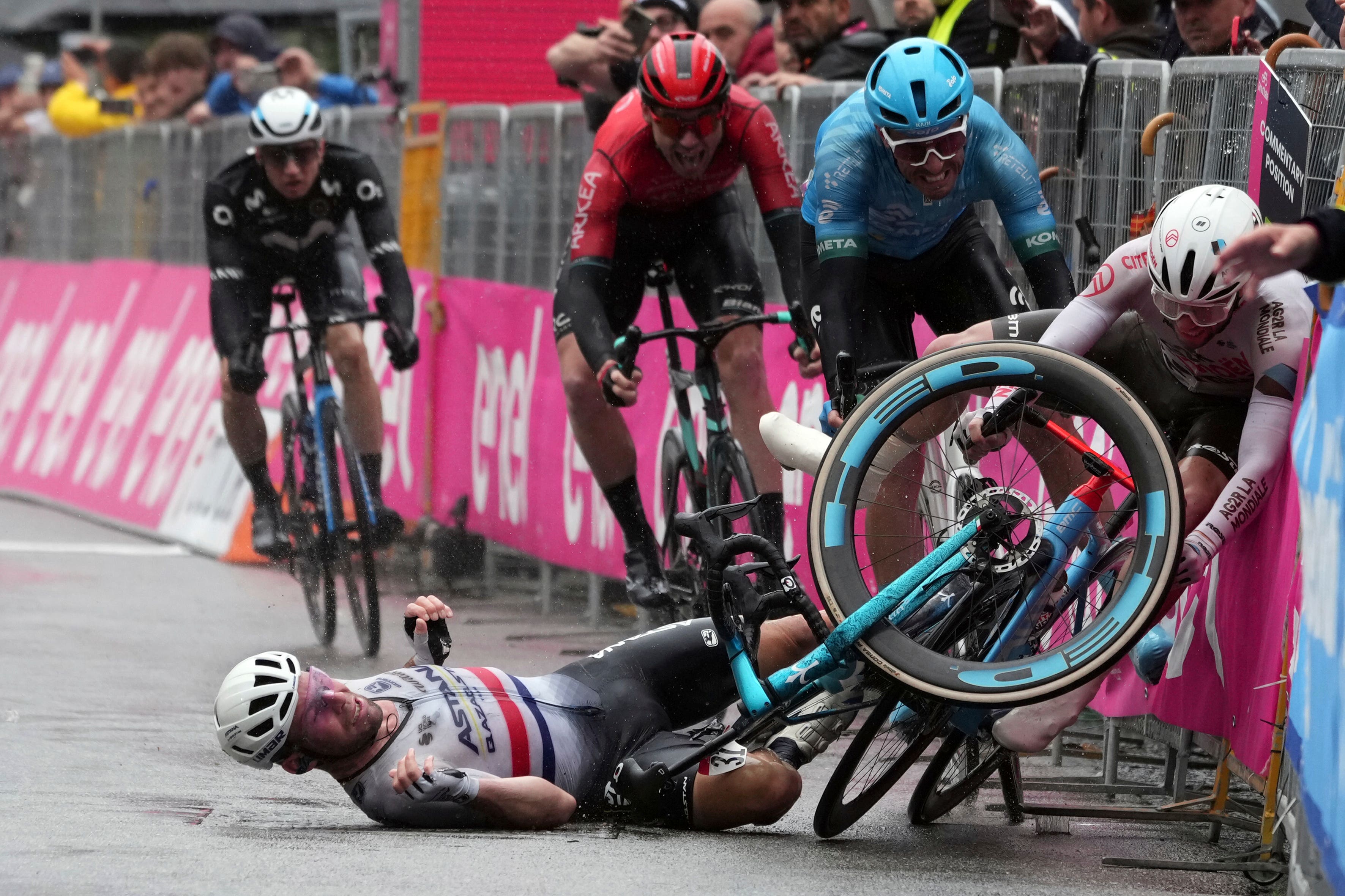 Mark Cavendish hit the deck hard but finished fifth after crossing the line on his backside