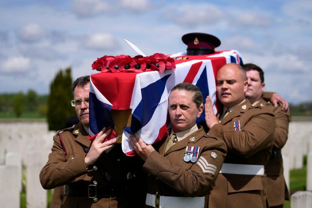 A bearer party carries the coffin of Private Robert Kenneth Malcolm, during a burial ceremony at the Commonwealth War Graves Commission’s Bedford House Cemetery in Ypres, Belgium (Virginia Mayo/AP)