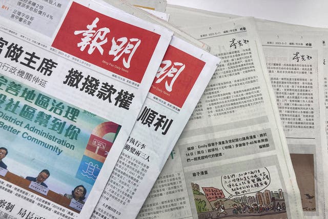 <p>Copies of the Chinese-language newspaper Ming Pao and a cartoon by Wong Kei-kwan is set up for a photo in Hong Kong</p>