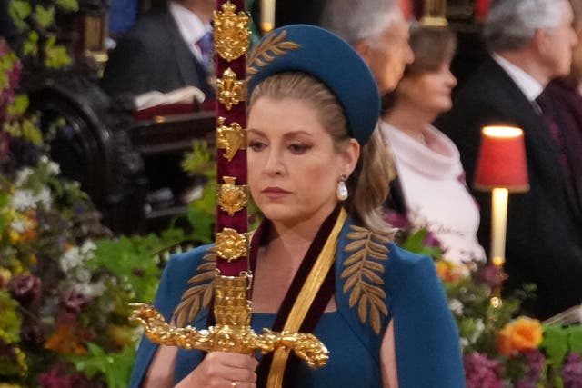 <p>Penny Mordaunt, carrying the Sword of State in procession through Westminster Abbey for the coronation of King Charles </p>