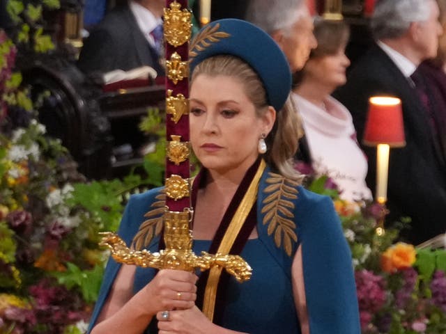 <p>Penny Mordaunt, carrying the Sword of State in procession through Westminster Abbey for the coronation of King Charles </p>