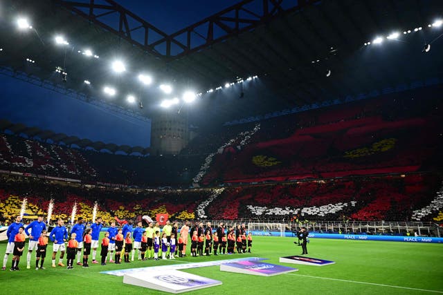 <p>Inter players and AC Milan players line up prior to the Champions League semi-final first leg</p>