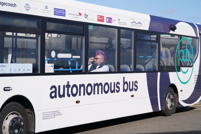 Bus driver Stuart Doidge sits in a passenger seat on board an autonomous bus (Andrew Milligan/PA)