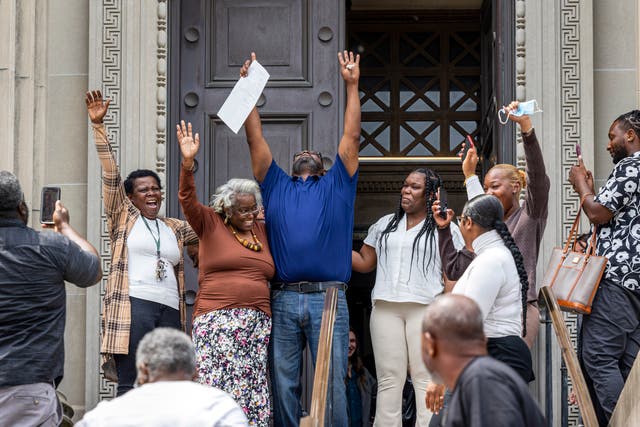 <p>Patrick Brown, center, with his arms raised after regaining his freedom in New Orleans on Monday, May 8, 2023 </p>