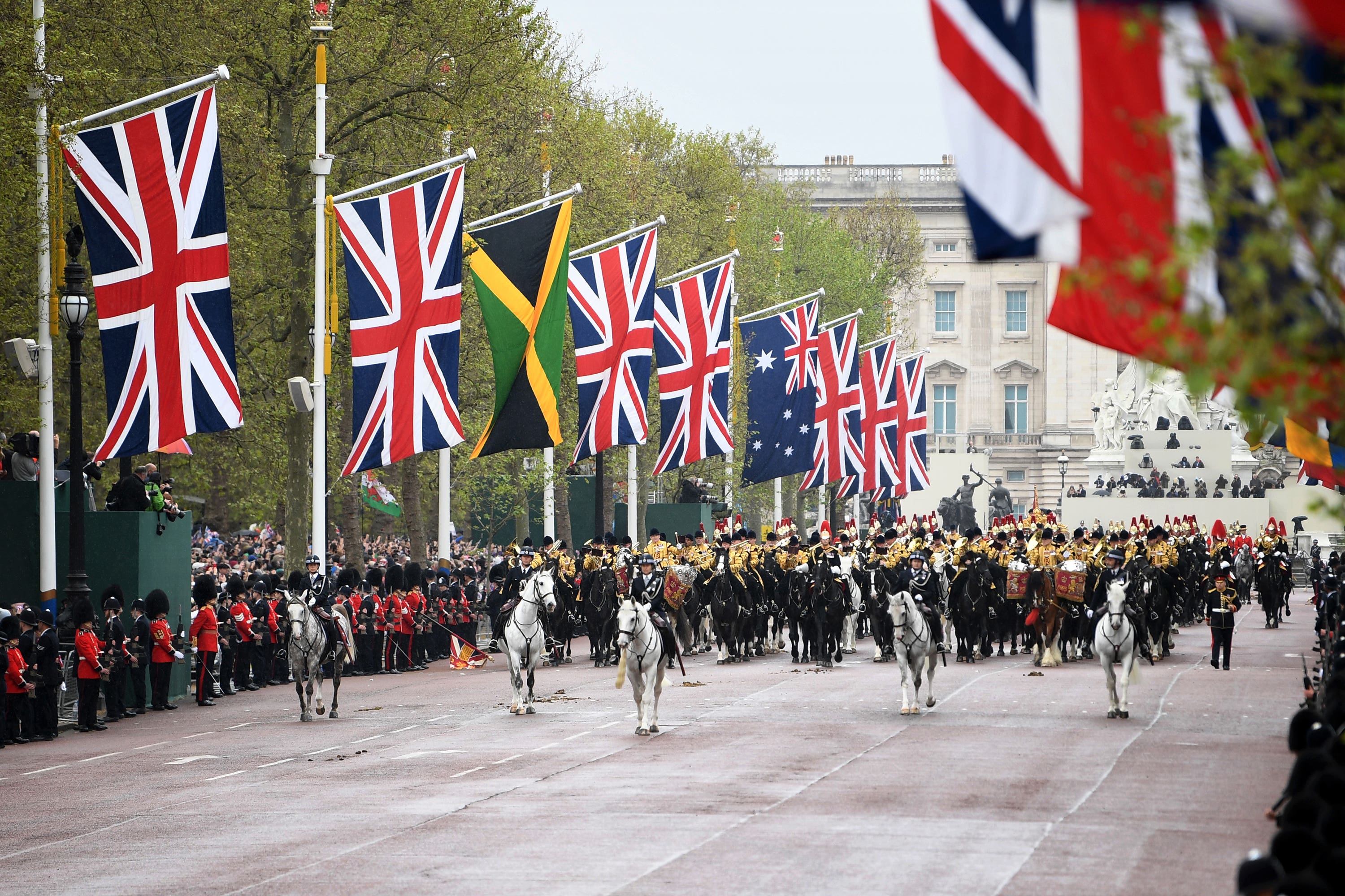 The King’s Procession passes along The Mall for the coronation ceremony at Westminster Abbey (Annabel Lee-Ellis/PA)