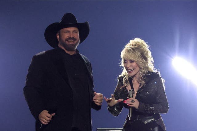 <p>Brooks and Parton at the 58th Academy of Country Music Awards on 11 May </p>