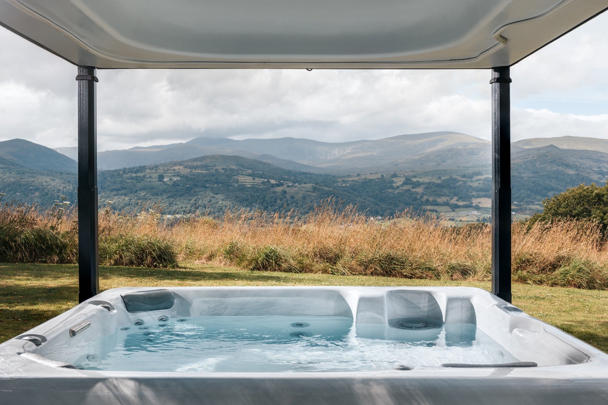 Marvel at mountain views from the luxury cabin’s hot tub