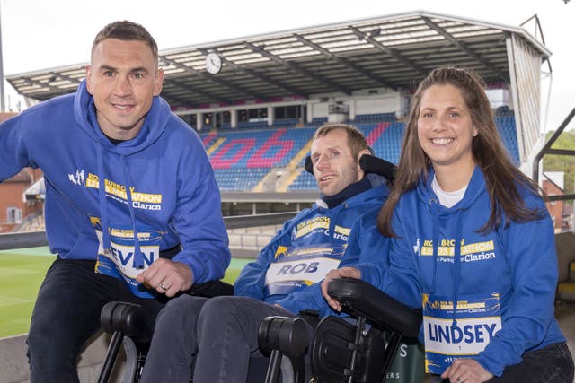 Rob Burrow, centre, wife Lindsey and Kevin Sinfield will be taking part in Sunday’s Rob Burrow Leeds Marathon (Danny Lawson/PA)