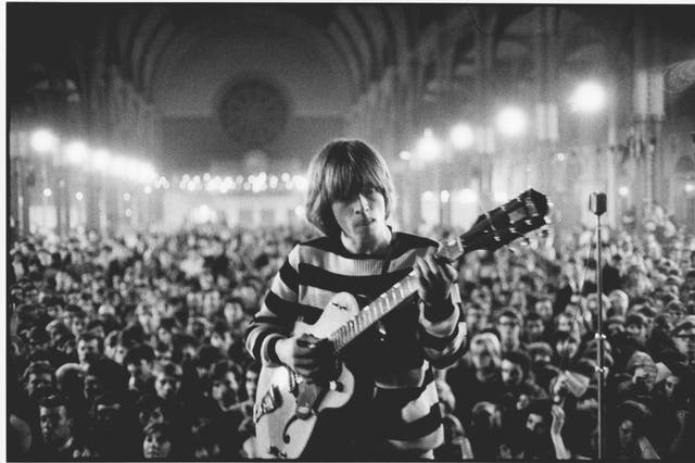 <p>Brian Jones on stage at Alexandra Palace in 1964 </p>