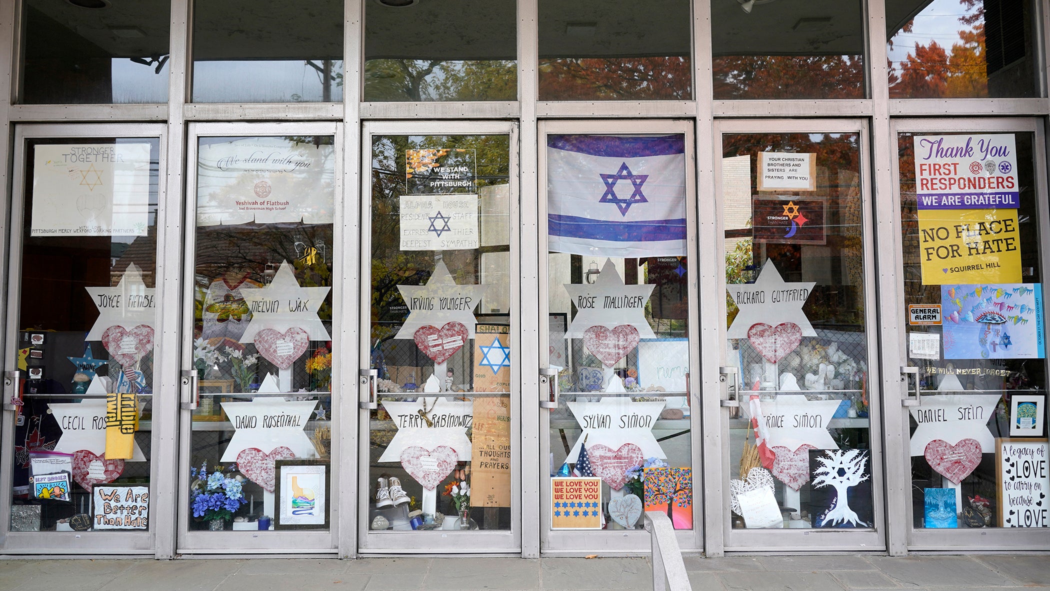 A memorial is placed inside the locked doors of the Tree of Life synagogue after the attack
