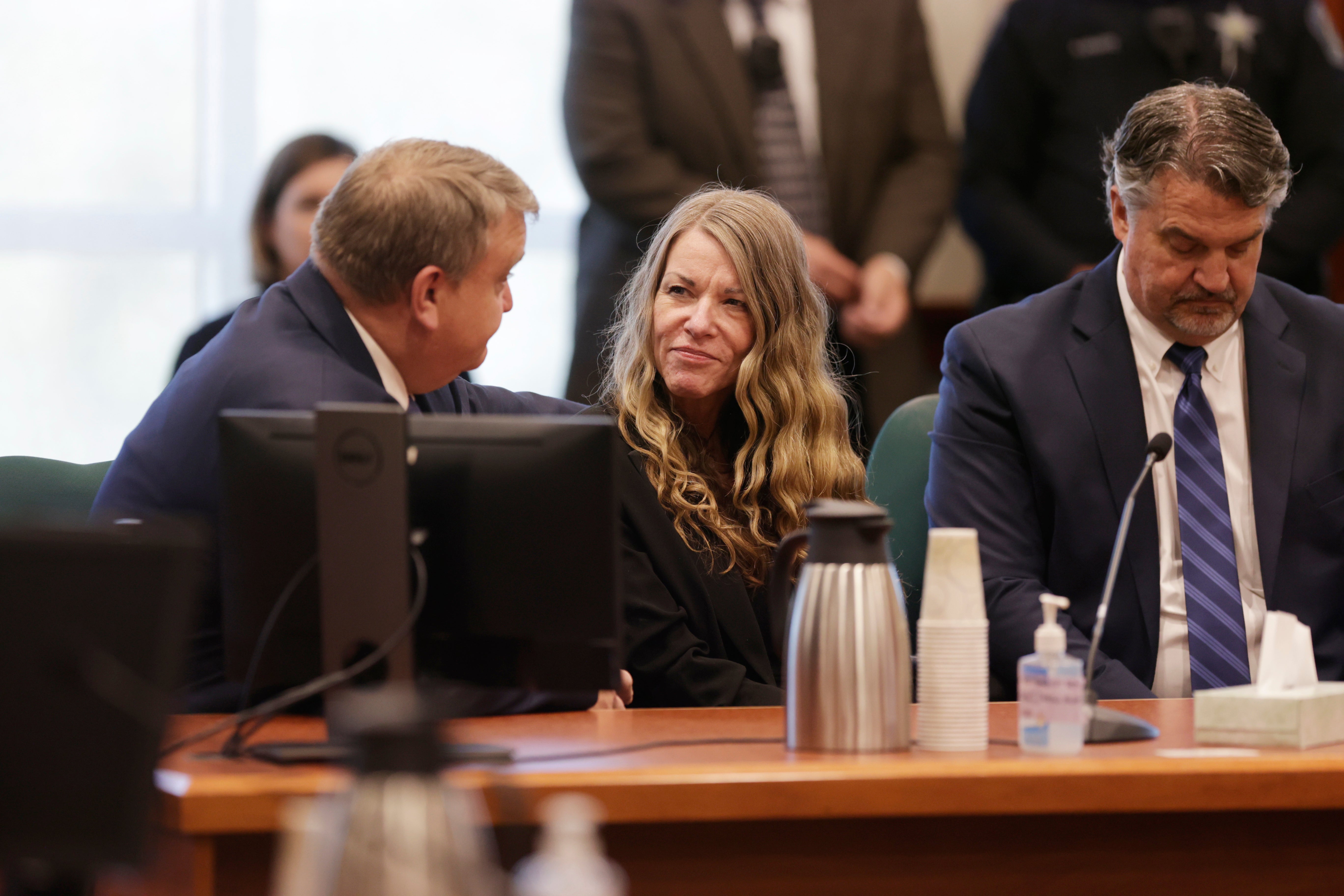 Lori Vallow Daybell talks with her lawyers before the jury’s verdict is read at the Ada County Courthouse in Boise, Idaho