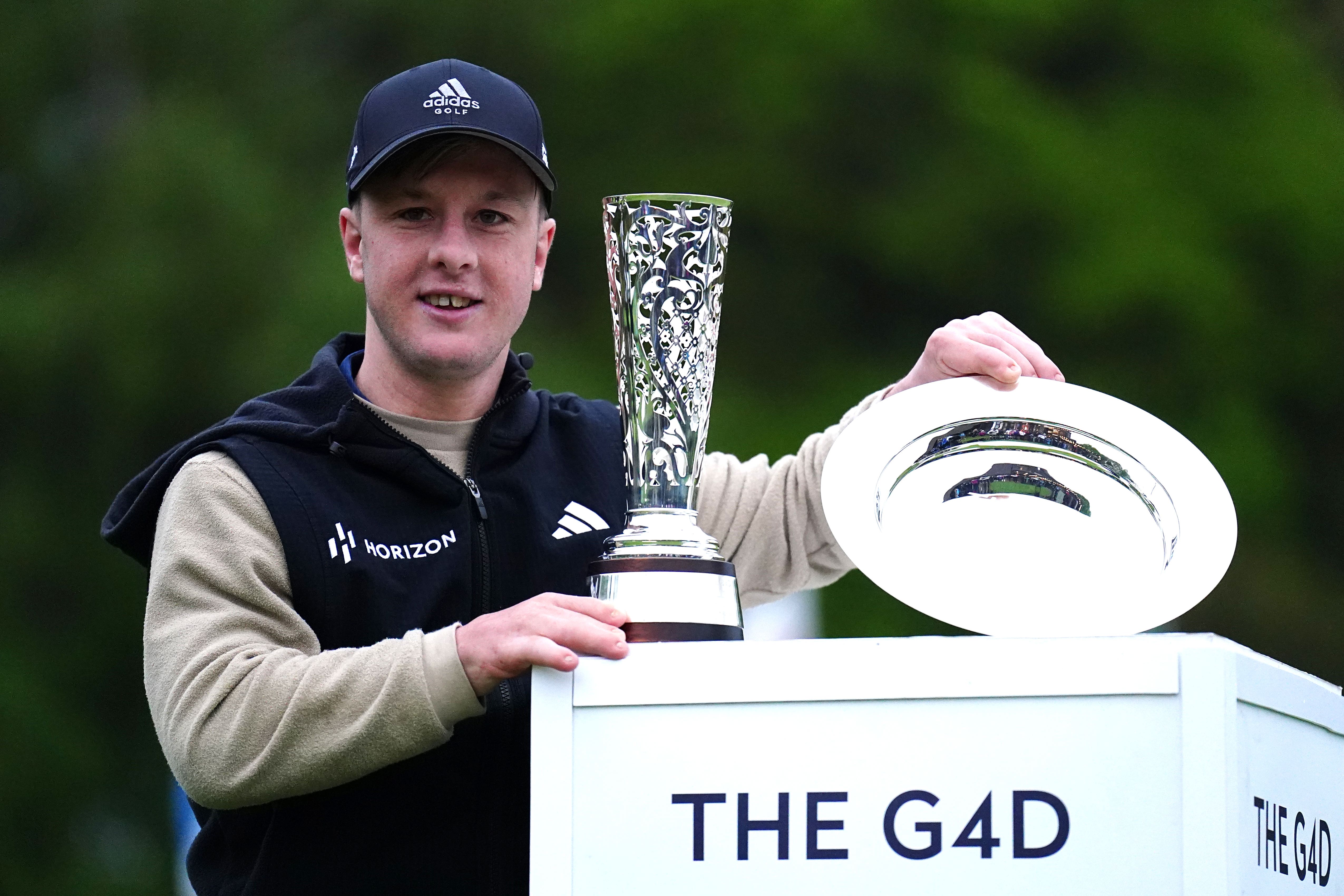 Brendan Lawlor poses with his trophy after winning The G4D Open at Woburn (Zac Goodwin/PA)