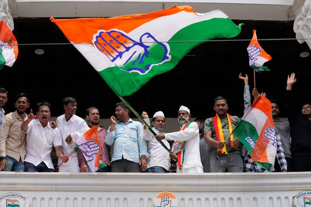 <p>Supporters of opposition Congress party wave flags to celebrate in Karnataka </p>