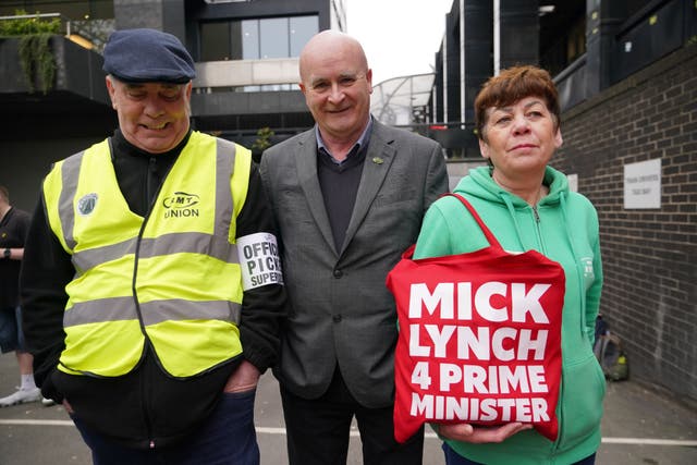 RMT general secretary Mick Lynch (centre) joins members of his union on the picket line outside Euston station (Yui Mok/PA)