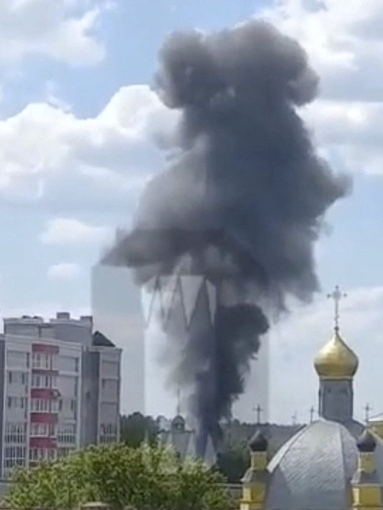 Smoke rises on the site of a helicopter crash in the town of Klintsy in Bryansk