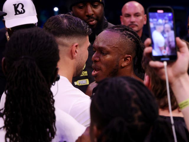 <p>KSI (right) faces off with Tommy Fury after beating Joe Fournier</p>