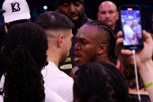 <p>KSI (right) faces off with Tommy Fury after beating Joe Fournier</p>