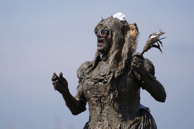 Competitors take part in the annual Maldon Mud Race, a charity event to race across the bed of the River Blackwater in Maldon, Essex (Joe Giddens/PA)