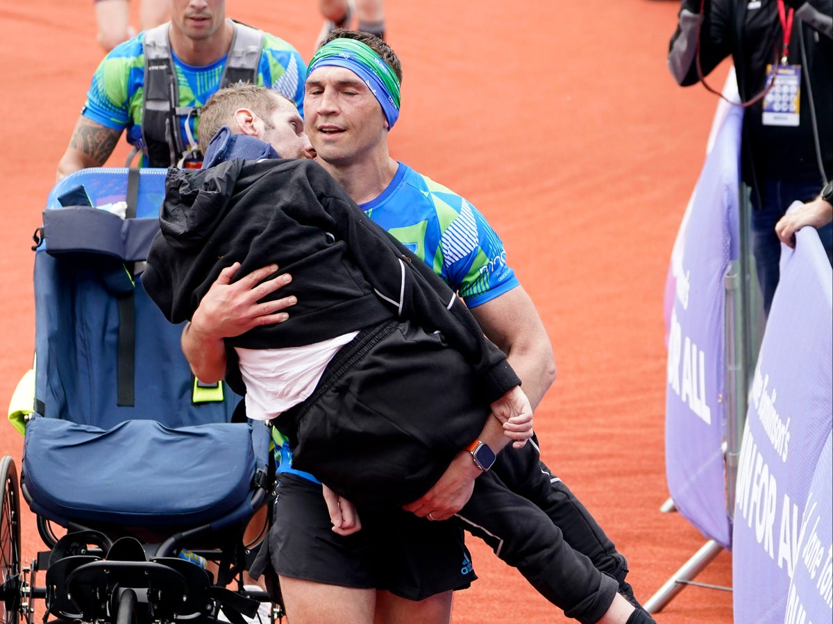 Rob Burrow carried over finish line by Kevin Sinfield in emotional moment at Leeds Marathon