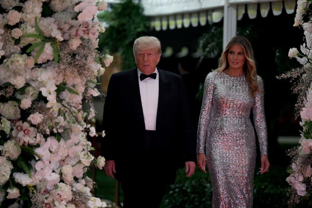 <p>Former US president Donald Trump and former first lady Melania Trump arrive for a New Years event at his Mar-a-Lago home on 31 December 2022 in Palm Beach, Florida</p>