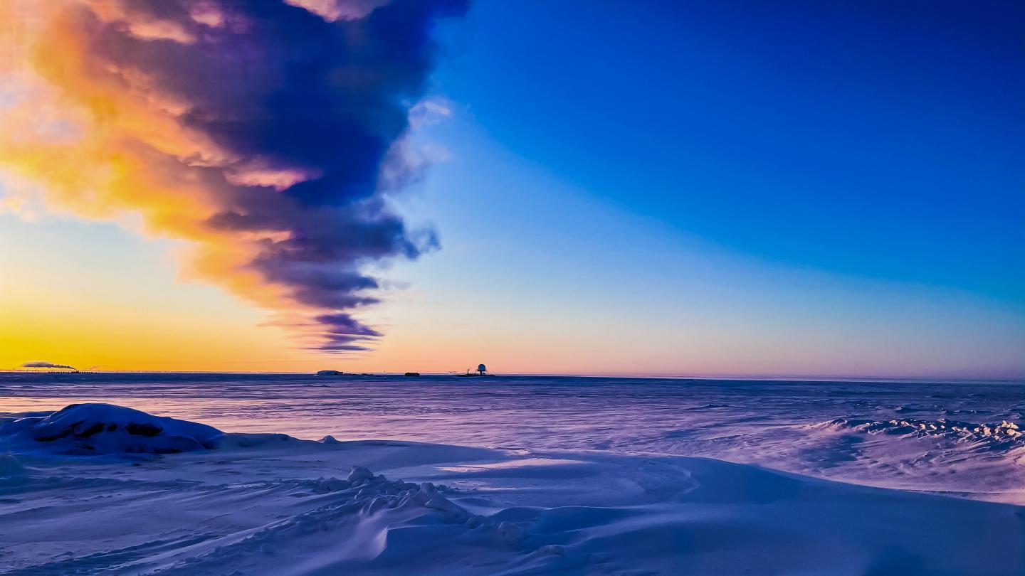<p>Peaceful sunrise at Oliktok Point in February 2021 when Sandia National Laboratories researchers began collecting the first-ever dataset from the Arctic seafloor</p>