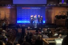 Watch: Protester dragged off stage after storming Rees-Mogg’s conference speech