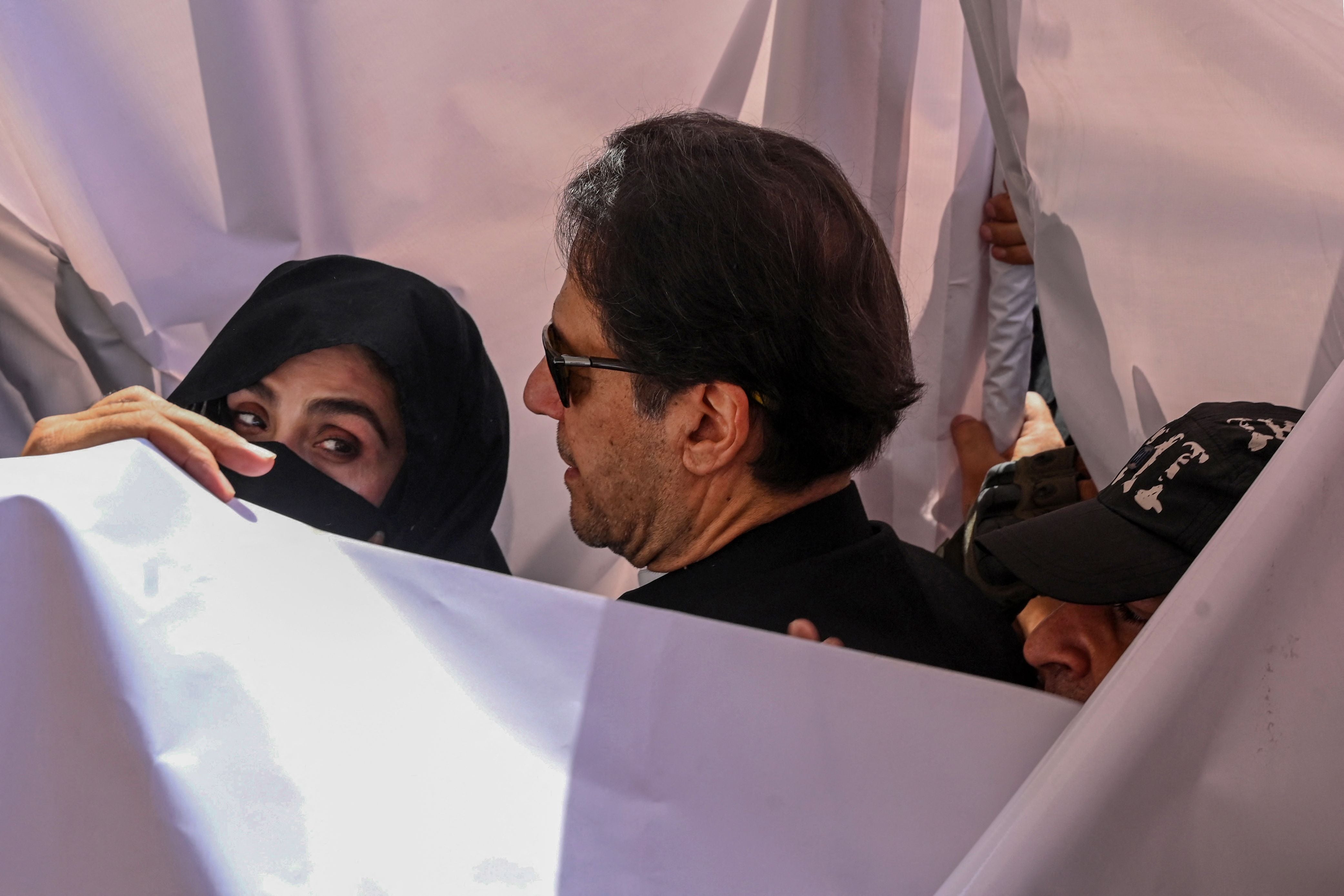 Former prime minister of Pakistan Imran Khan and his wife Bushra Bibi appear at a high court in Lahore