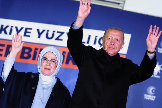 <p>Turkish President Tayyip Erdogan, accompanied by his wife Ermine Erdogan, greets supporters at the AKP headquarters in Ankara</p>