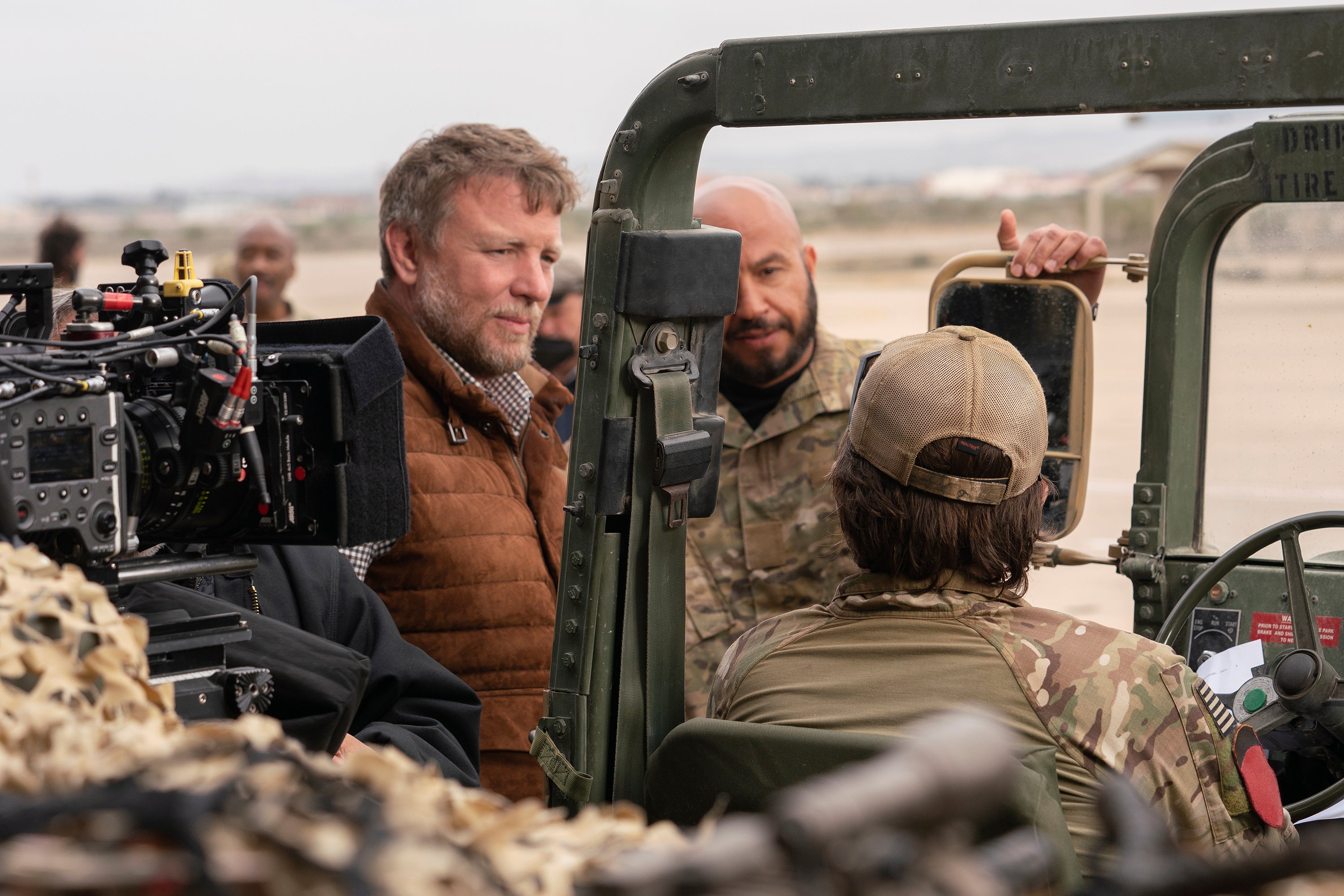 Director Guy Ritchie, left, and actor Dar Salim on the set of "Guy Ritchie's The Covenant."