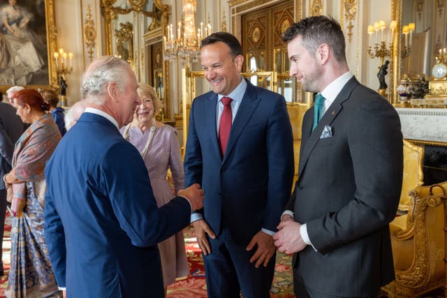 Leo Varadkar and his partner Matt Barrett with King Charles during a reception at Buckingham Palace prior to the coronation (Ian Jones/PA)