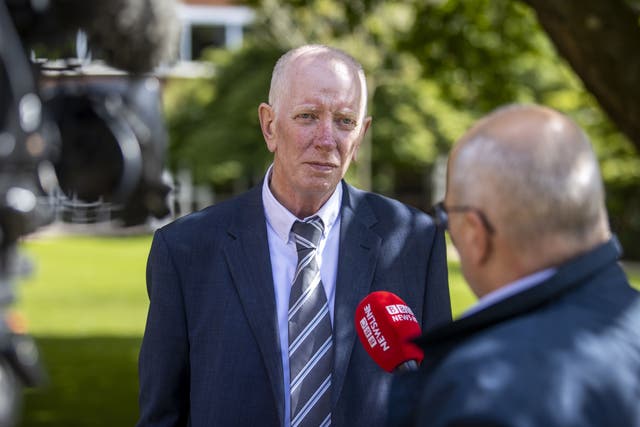 Paul Crawford speaks to the media outside Queens University Belfast (Liam McBurney/PA)