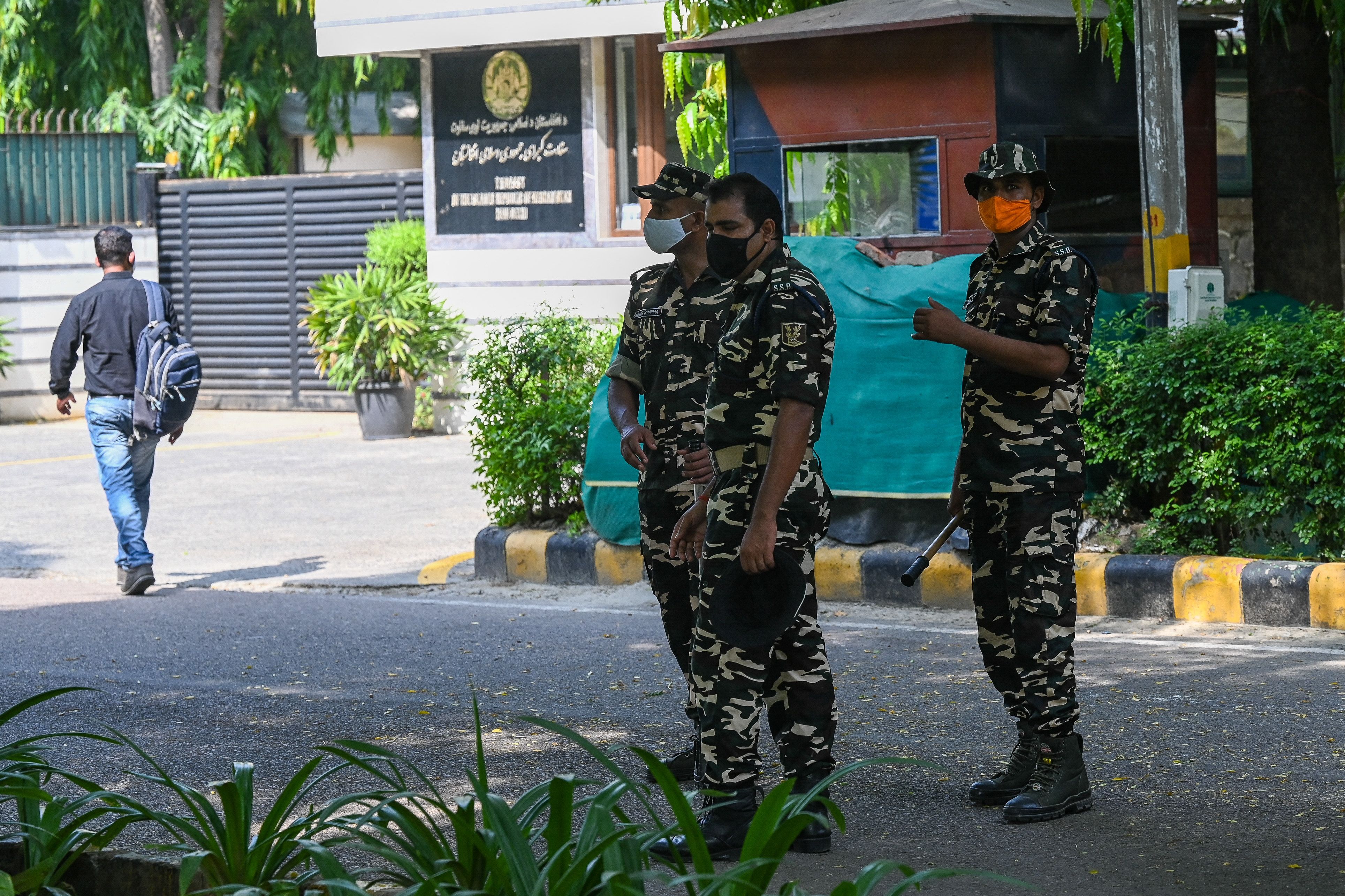 Security personnel stand guard outside Afghanistan embassy in New Delhi