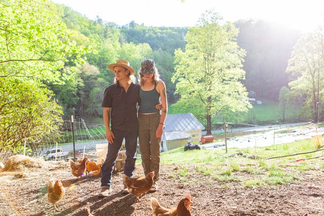 <p>Alex O’Neill, left, and Jess McClelland on their 16-acre property in Triplett, North Carolina</p>