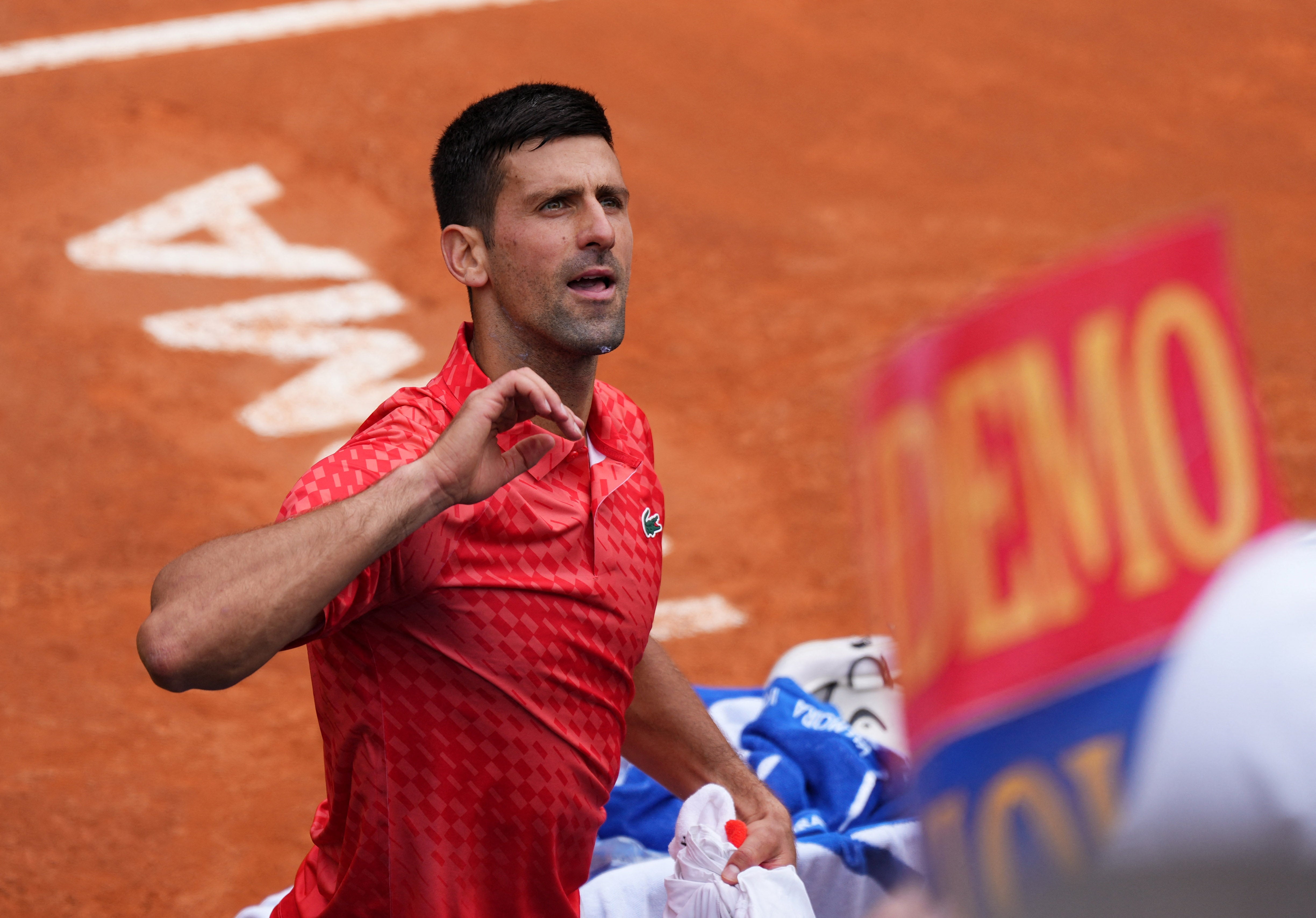 Novak Djokovic reacts after reaching the Italian Open quarter-finals