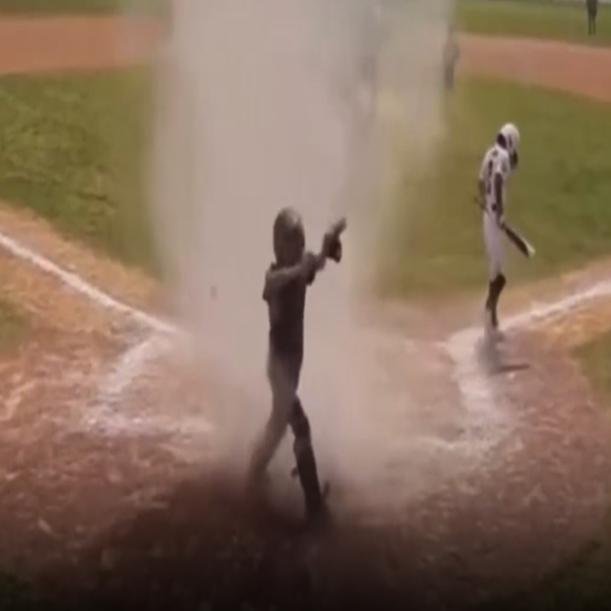 Moment dust devil engulfs 7-year-old baseball player in middle of game |  Sport | Independent TV