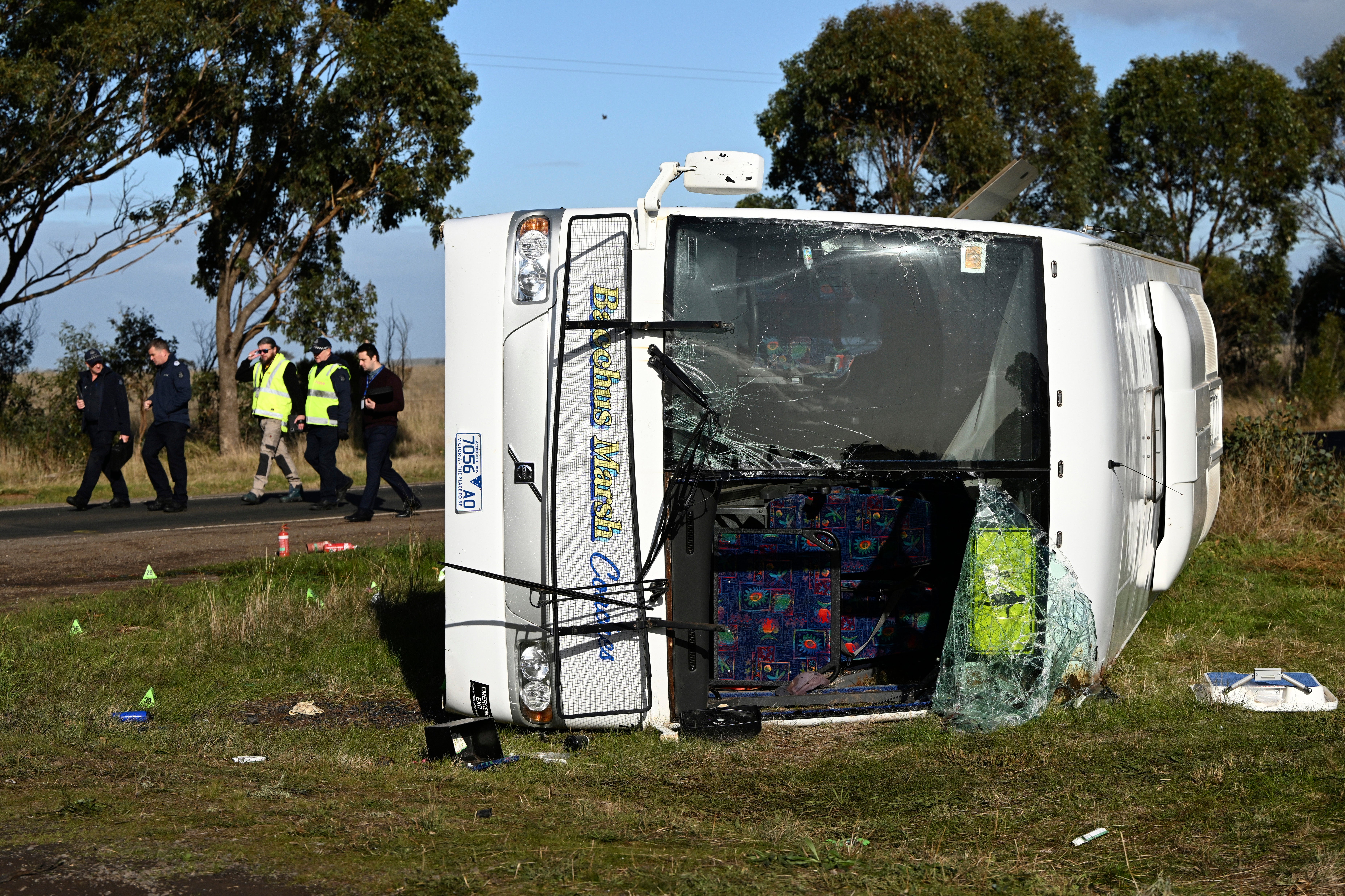 Investigators work at the scene of a bus crash near in Melbourne, Wednesday, May 17, 2023.