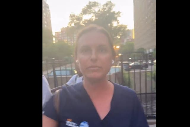 <p>Sarah Comrie is seen arguing with a group of men over a Citi Bike which both parties claimed they had rented </p>