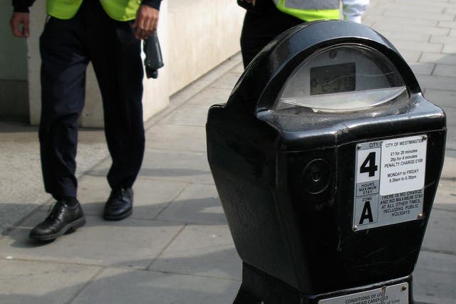 Generic stock picture showing a parking meter and traffic wardens in central London (PA)