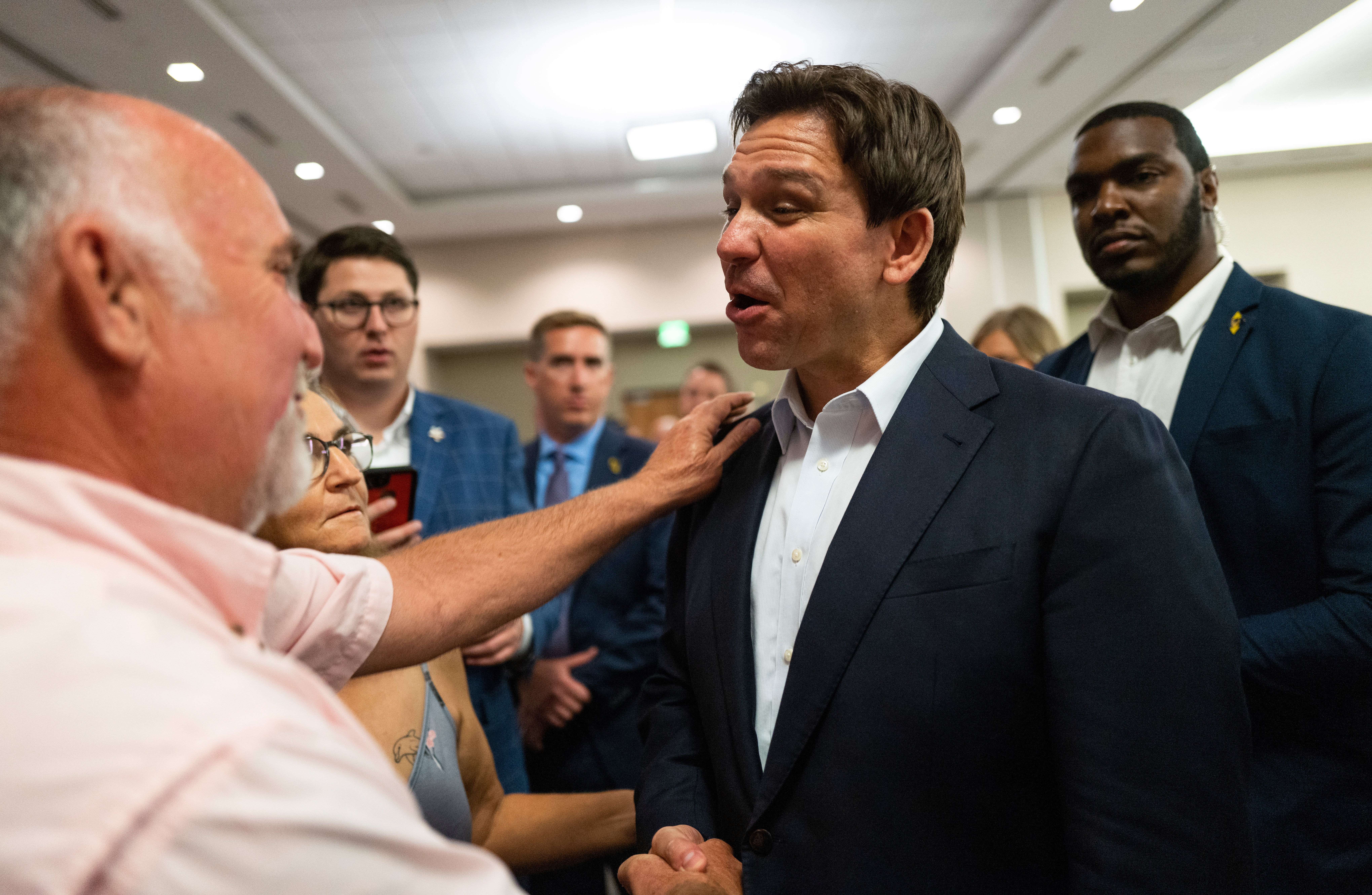 Florida governor Ron DeSantis speaks with attendees during an Iowa GOP reception on 13 May 2023 in Cedar Rapids, Iowa