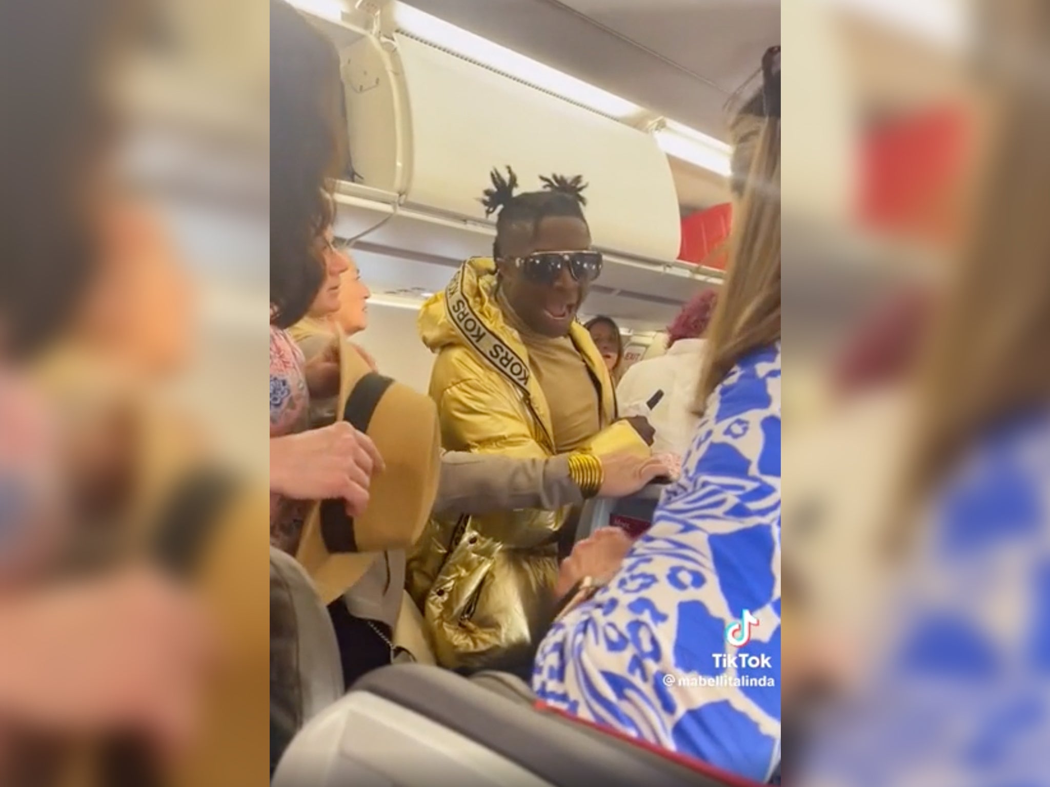 In a since-deleted video, the traveller is seen forcing his way past fellow passengers