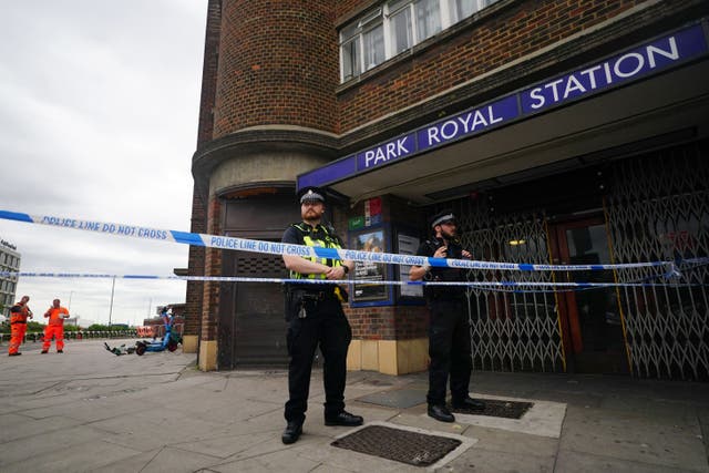 Police outside Park Royal underground station, west London after the crash in which the Range Rover ended up on a railway track for the Piccadilly underground line (Victoria Jones/PA)
