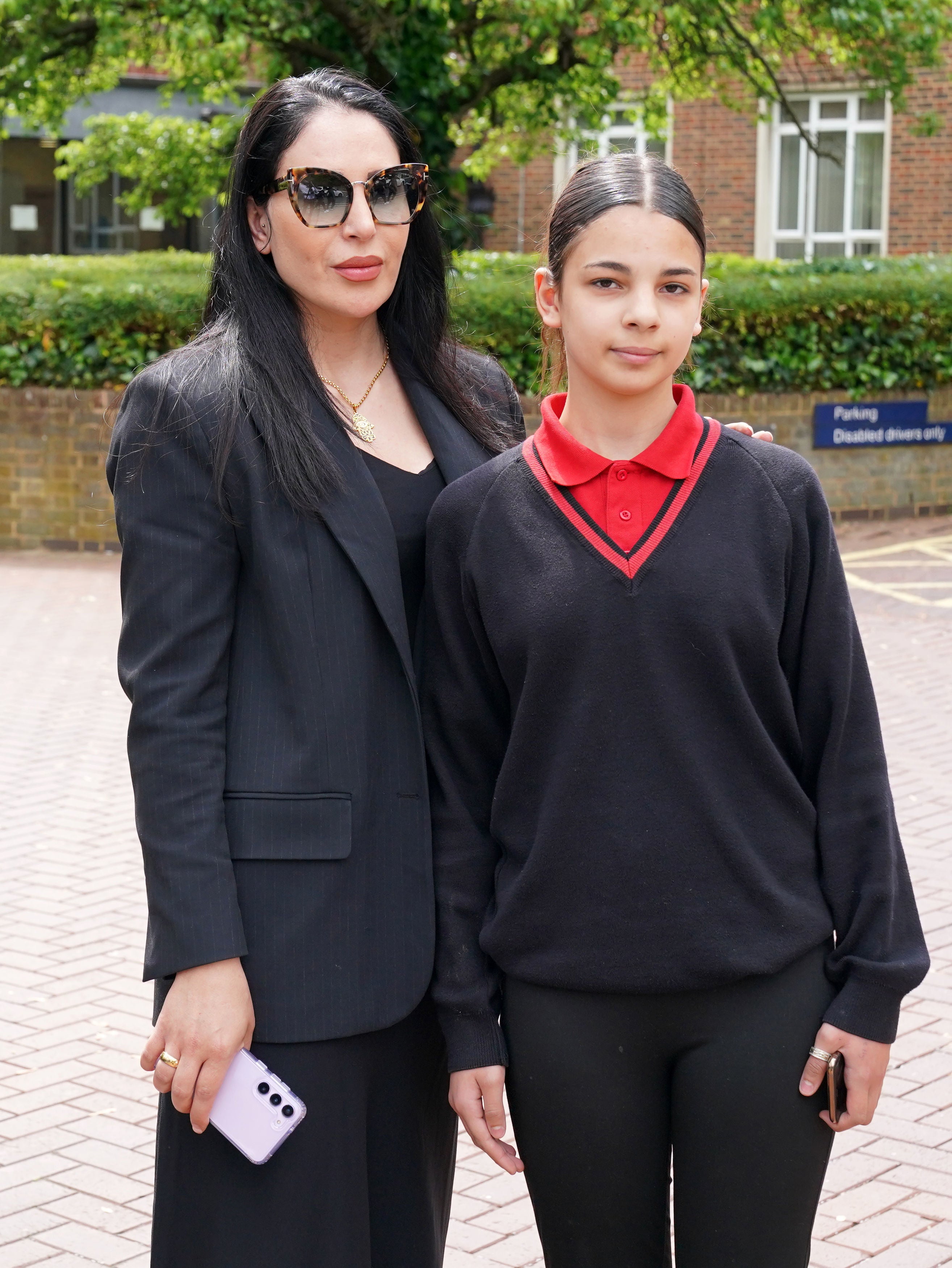 Maya Kodsi, 37, (left) sister of Yagmur Ozden, 33, and her daughter Melek Ozden, 13 outside Isleworth Crown Court