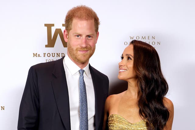 <p>Harry and Meghan photographed in May </p>