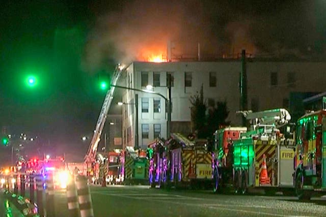 A video still of fire engines outside a hostel in central Wellington, New Zealand, the scene of a fatal blaze (NewsHub via AP/PA)
