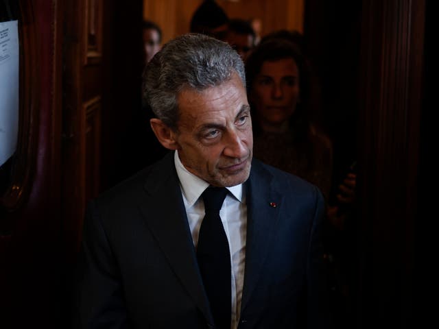<p>Nicolas Sarkozy exits the courthouse after the verdict</p>