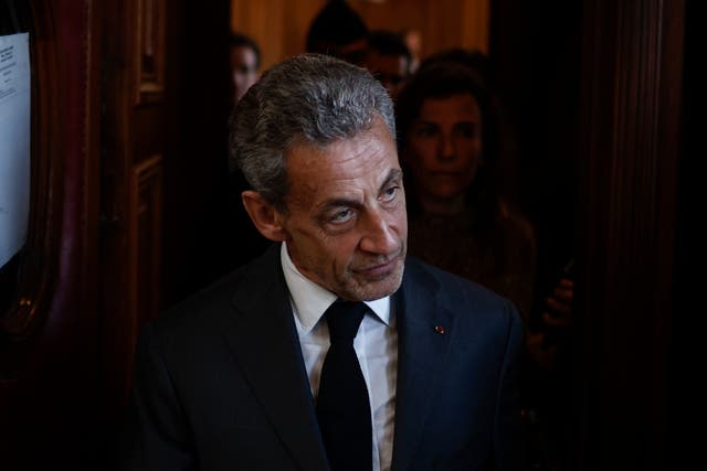 <p>Nicolas Sarkozy exits the courthouse after the verdict</p>