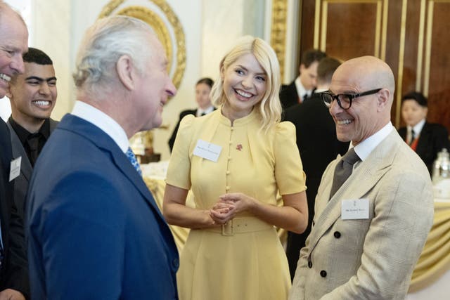 The King meets Prince’s Trust award winners and the charity’s celebrity ambassadors, Holly Willoughby and Stanley Tucci, during a reception at Buckingham Palace in London (Geoff Pugh/Daily Telegraph)