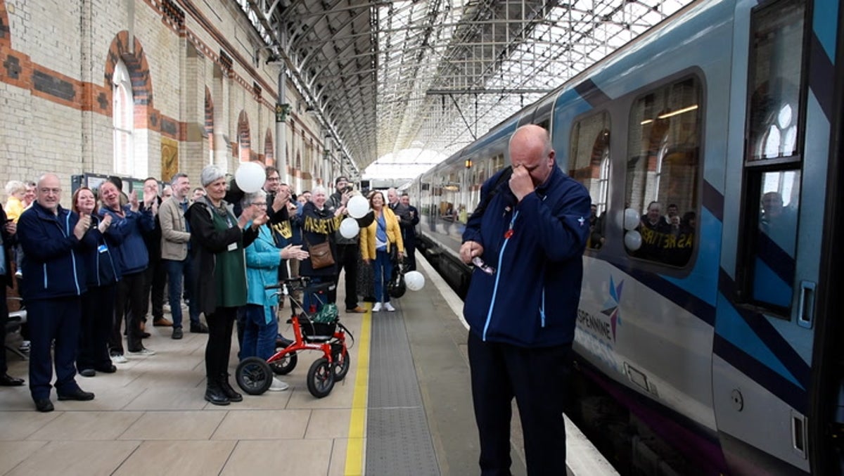 Moment retiring train driver sobs after final journey of 52 year career