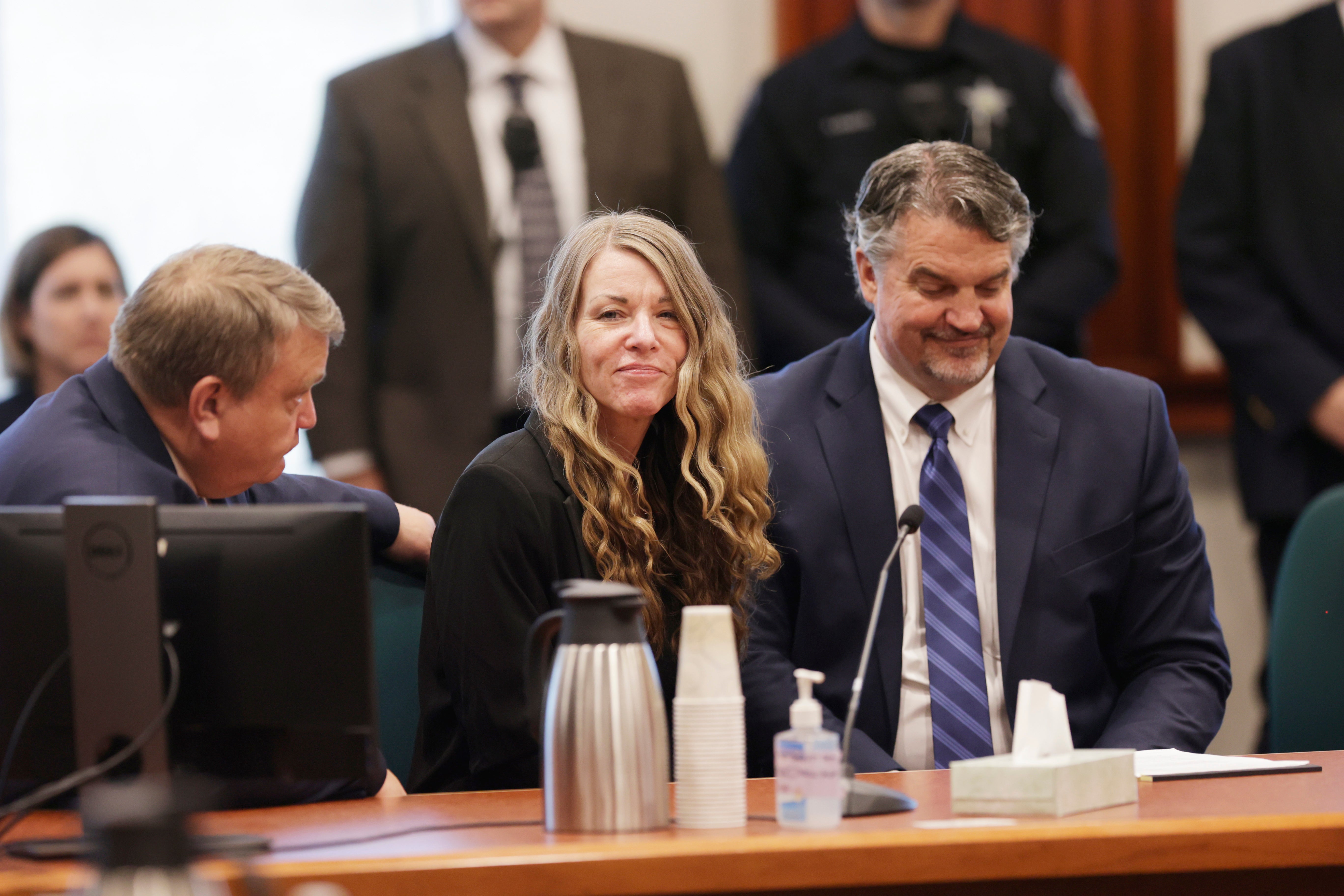 Lori Vallow talks with her lawyers before the jury’s verdict is read at her murder trial